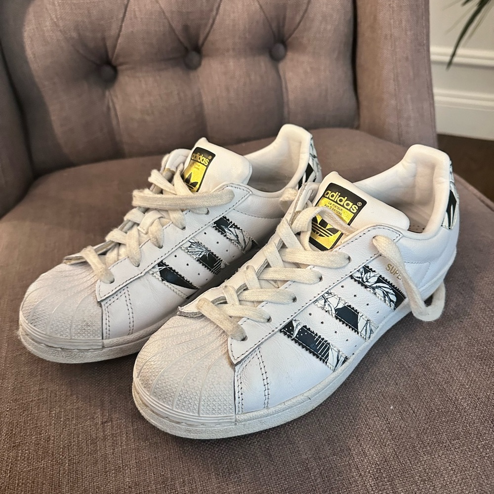 Adidas black and gold shell tops